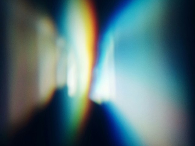abstraktes Bild, Lichtschein und schwarzer Hintergrund