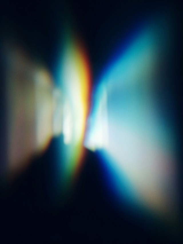 abstraktes Bild, Lichtschein und schwarzer Hintergrund